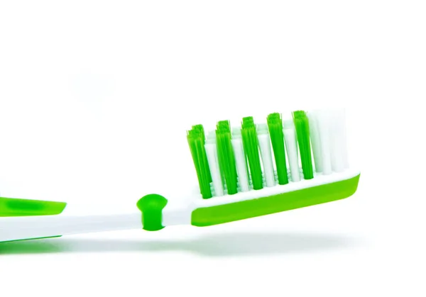 Green toothbrush isolated on white — Stock Photo, Image