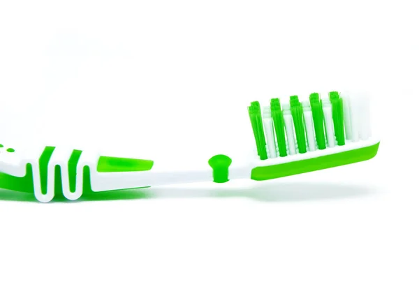 Green toothbrush isolated on white — Stock Photo, Image