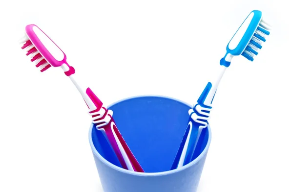 Two toothbrushes in glass — Stock Photo, Image