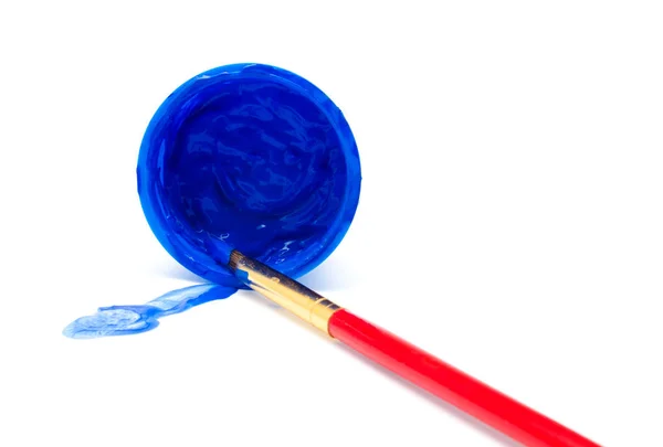 Blue color paint in a jar and brush — Stock Photo, Image