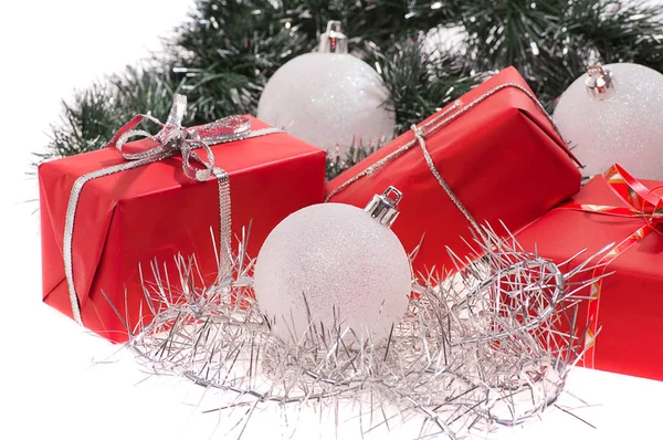Red gifts with silver tinsel — Stock Photo, Image
