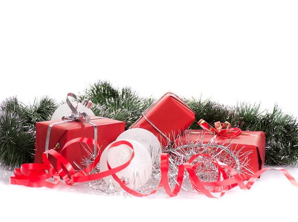 Red gifts with silver tinsel — Stock Photo, Image