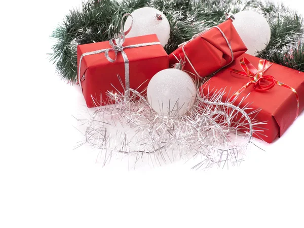 Red gifts with silver tinsel — Stock Photo, Image