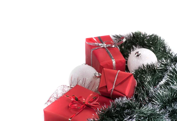 Red gifts with silver tinsel Royalty Free Stock Images