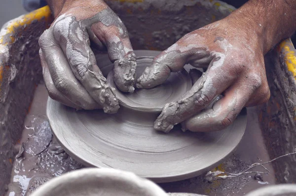 Hands wheel pottery Stock Photo