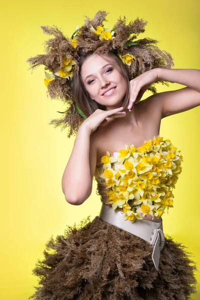 woman in a wreath of reeds and daffodils