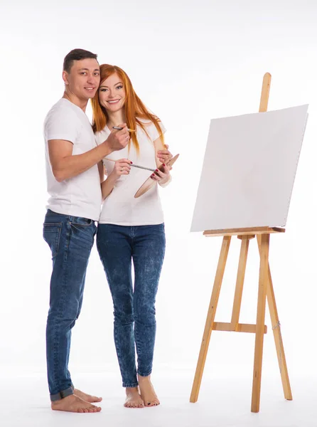 guy and the girl draw paints