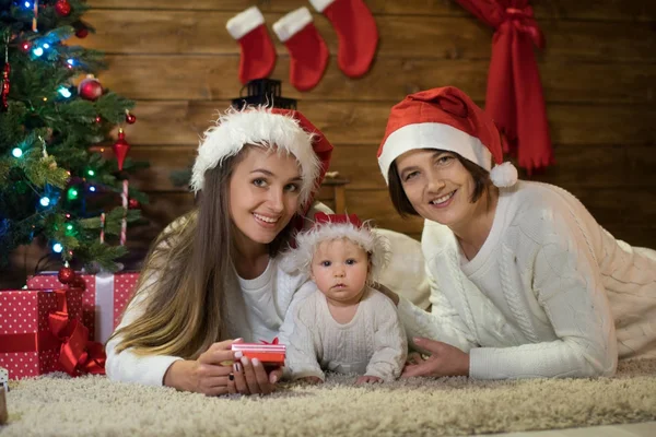 grandmother mom and granddaughter in christmas