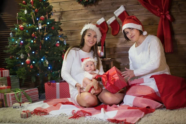 grandmother mom and granddaughter in christmas