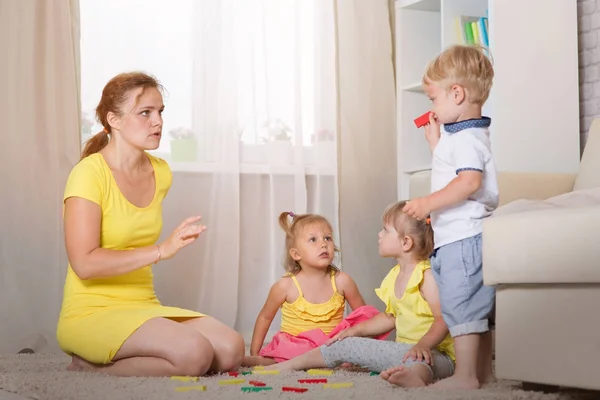 Mom plays with children twins