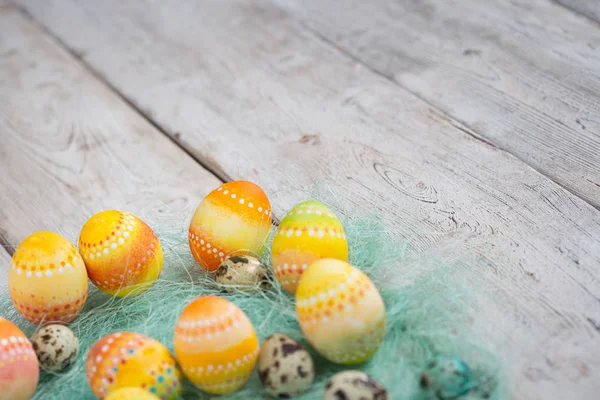 Painted Easter eggs on old boards