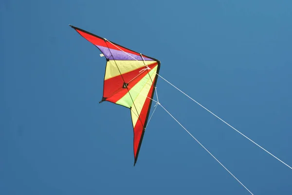 Boy flying a colorful kite — Stock Photo, Image