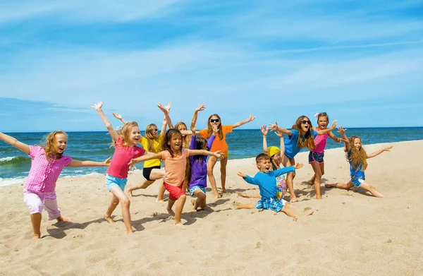 Active happy children on the beach Stock Photo