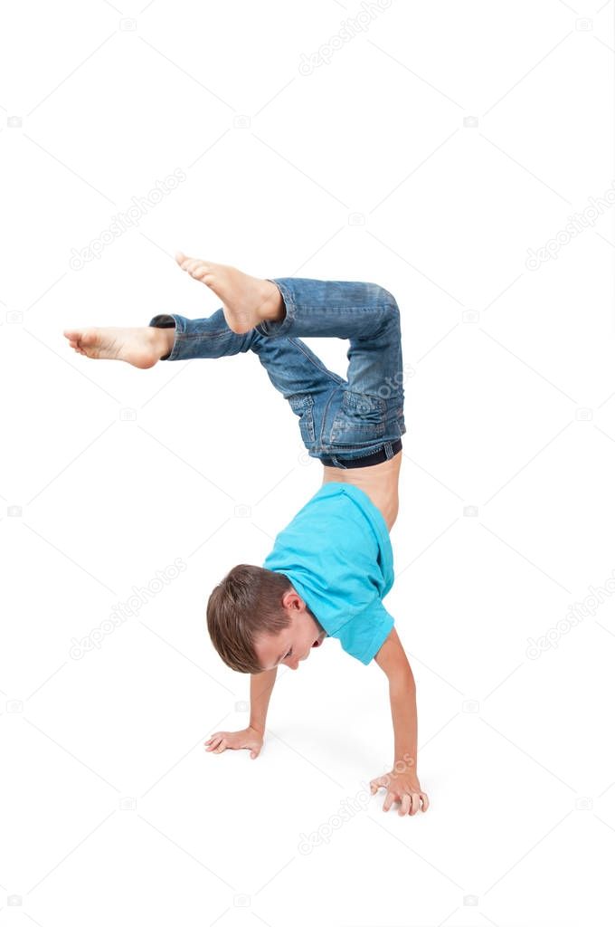 Young boy doing handstand