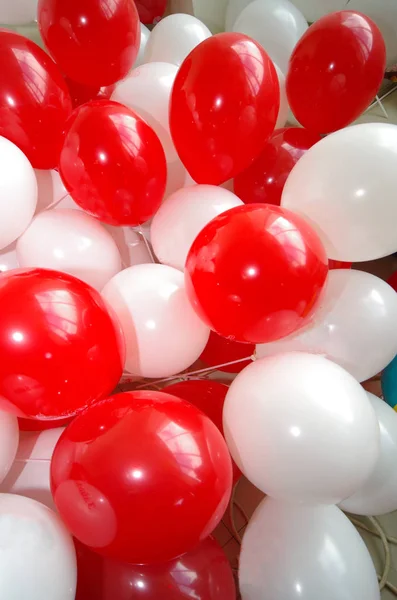 Red and white balloons.