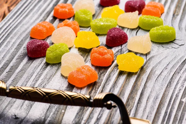 Tasty jelly candies on wooden background — Stock Photo, Image