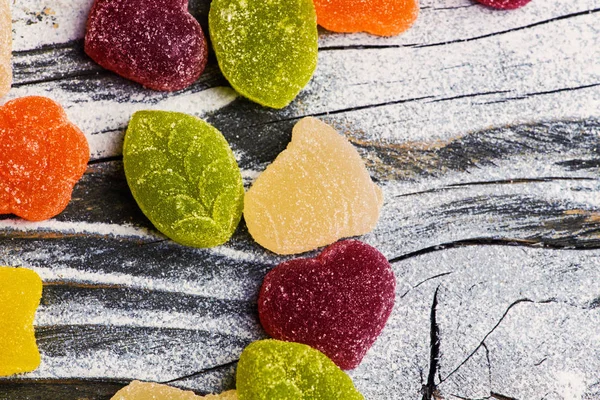 Tasty jelly candies on wooden background — Stock Photo, Image