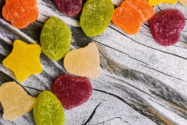 Tasty jelly candies on wooden background — Stock Photo, Image