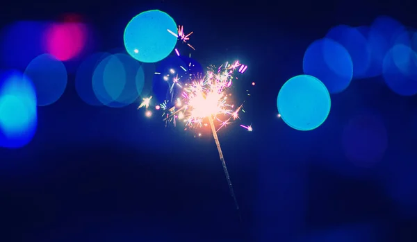 Christmas sparkler glowing in the dark Royalty Free Stock Photos