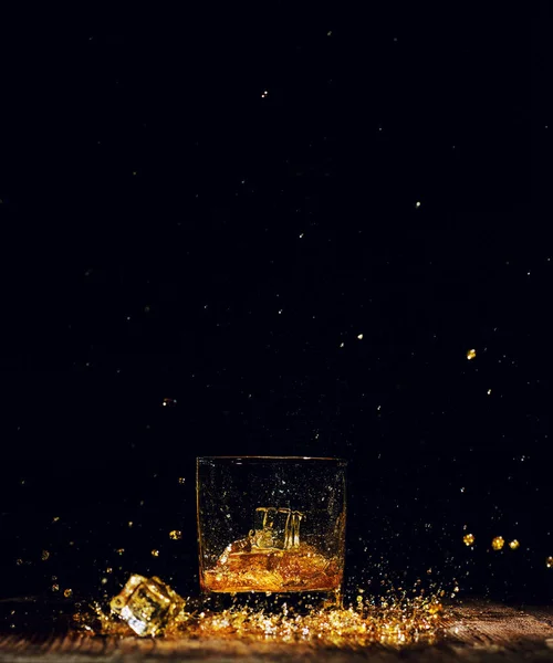 Isolated shot of whiskey on wooden background — Stock Photo, Image