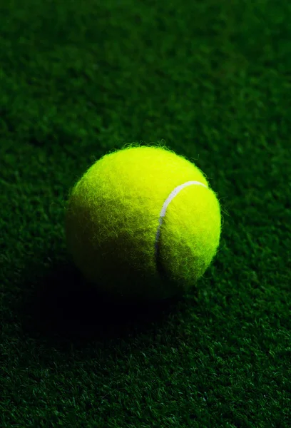 Tennis Ball isolated on black with dramatic lighting — Stock Photo, Image