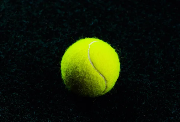 Tennis Ball isolated on black with dramatic lighting — Stock Photo, Image