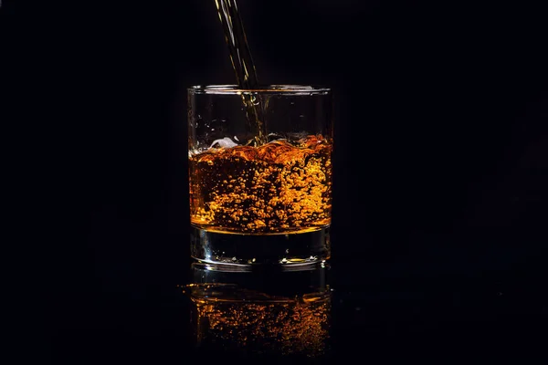 Isolated shot of whiskey on wooden background — Stock Photo, Image