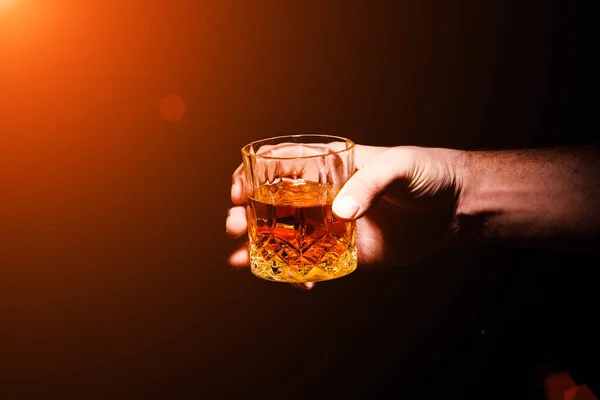 Whiskey glass in a hand of a man — Stock Photo, Image