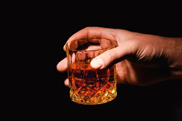 Whiskey glass in a hand of a man — Stock Photo, Image