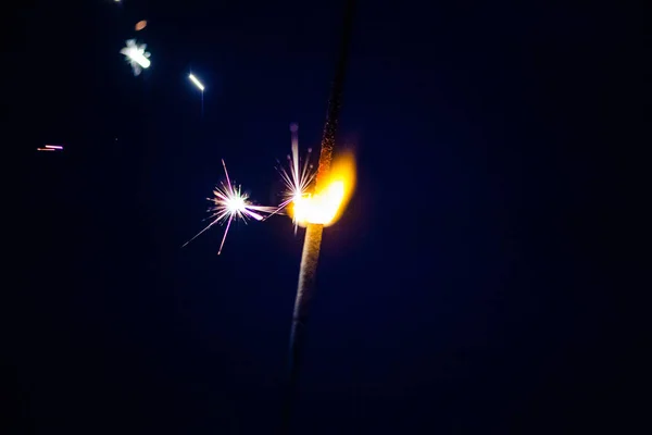 Sparks in the dark. Sparks. Christmas and New Year time. Magic l