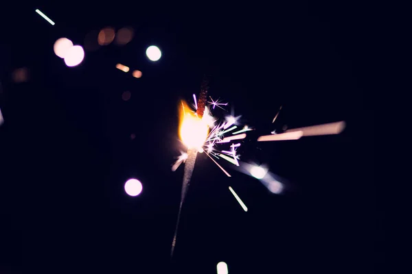 Sparks in the dark. Sparks. Christmas and New Year time. Magic l — Stockfoto