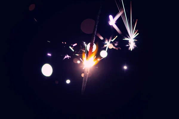 Sparks in the dark. Sparks. Christmas and New Year time. Magic l — Stockfoto