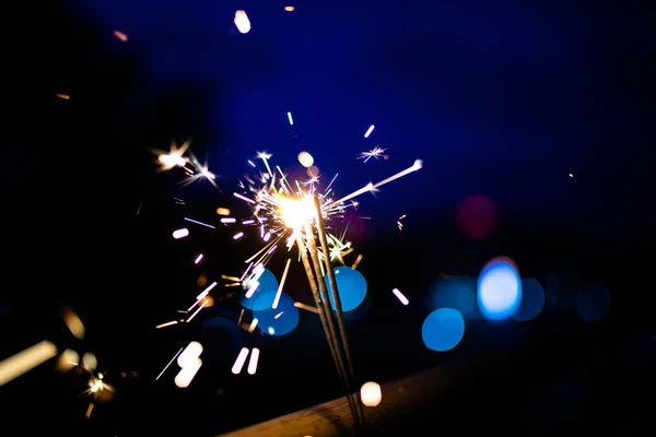 Sparks in the dark. Sparks. Christmas and New Year time. Magic l — Stock Photo, Image