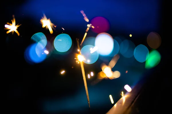 Sparks in the dark. Sparks. Christmas and New Year time. Magic l — Stock Photo, Image