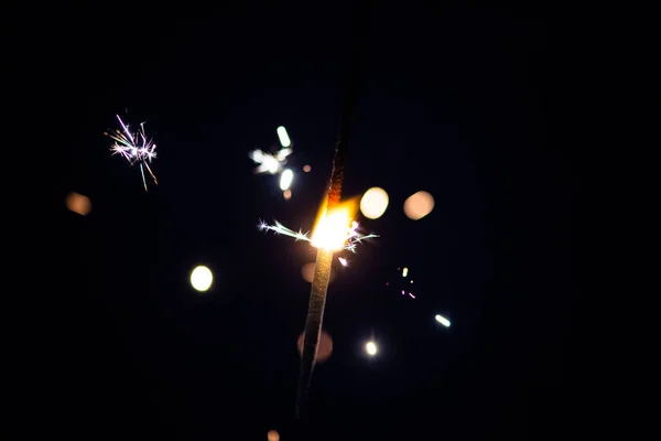 Sparks in the dark. Sparks. Christmas and New Year time. Magic l — Stockfoto