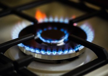 Natural gas burning on kitchen gas stove clipart