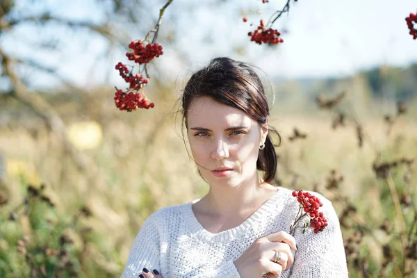 Portrait of a girl with a branch of mountain ash — Stock Photo, Image