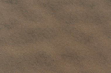 Deniz kıyısındaki kahverengi kum deseni