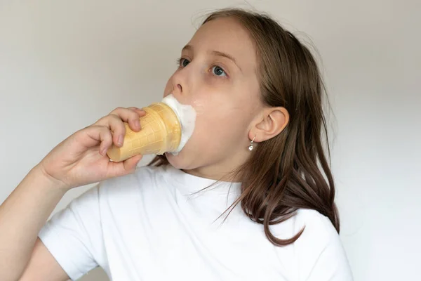 little girl eating ice cream in the studio