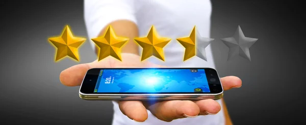 Business man rating stelle con il suo telefono cellulare — Foto Stock