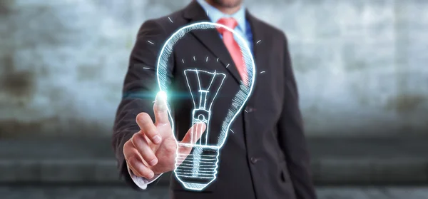 Businessman touching a sketch lightbulb innovation concept — Stock Photo, Image