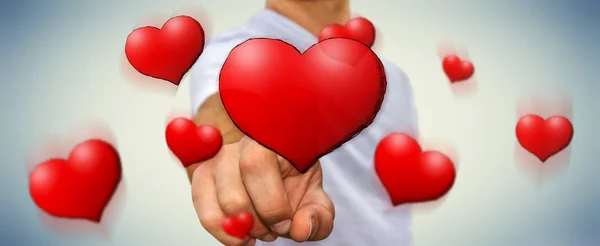 Jovem tocando mão desenhado coração vermelho — Fotografia de Stock