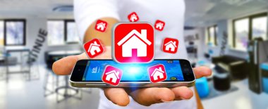Bir daire kiralamak için modern cep telefonu kullanarak iş adamı