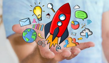 Kırmızı tutan işadamı çizilmiş roket elinde el.