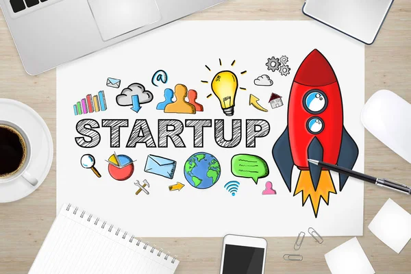 Hand drawn startup text with icons on office background — Stock Photo, Image