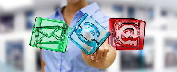 Businesswoman touching transparent cube contact icon with her fi