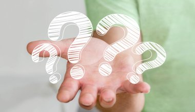 Elle çizilmiş soru işaretleri elinde tutan işadamı