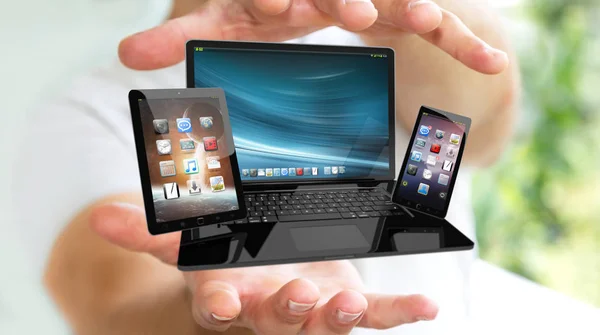 Бізнесмен тримає ноутбук і планшет в руці 3D — стокове фото
