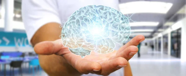 Empresário segurando raio-X cérebro humano em sua mão — Fotografia de Stock
