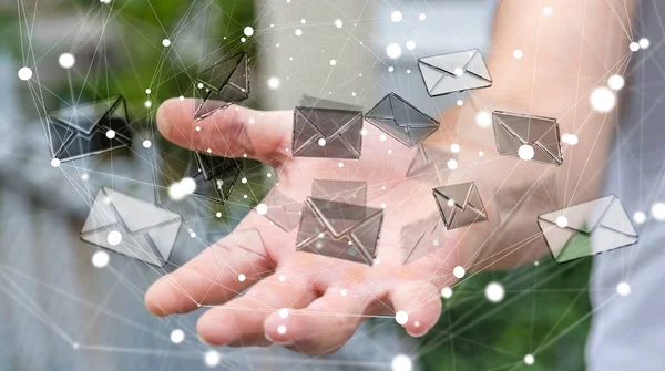 Geschäftsmann hält 3D-Rendering fliegendes E-Mail-Symbol in der Hand — Stockfoto